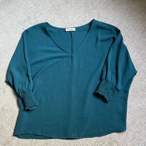 Gorgeous teal blue dolman sleeve top with v neck and cuffed sleeves